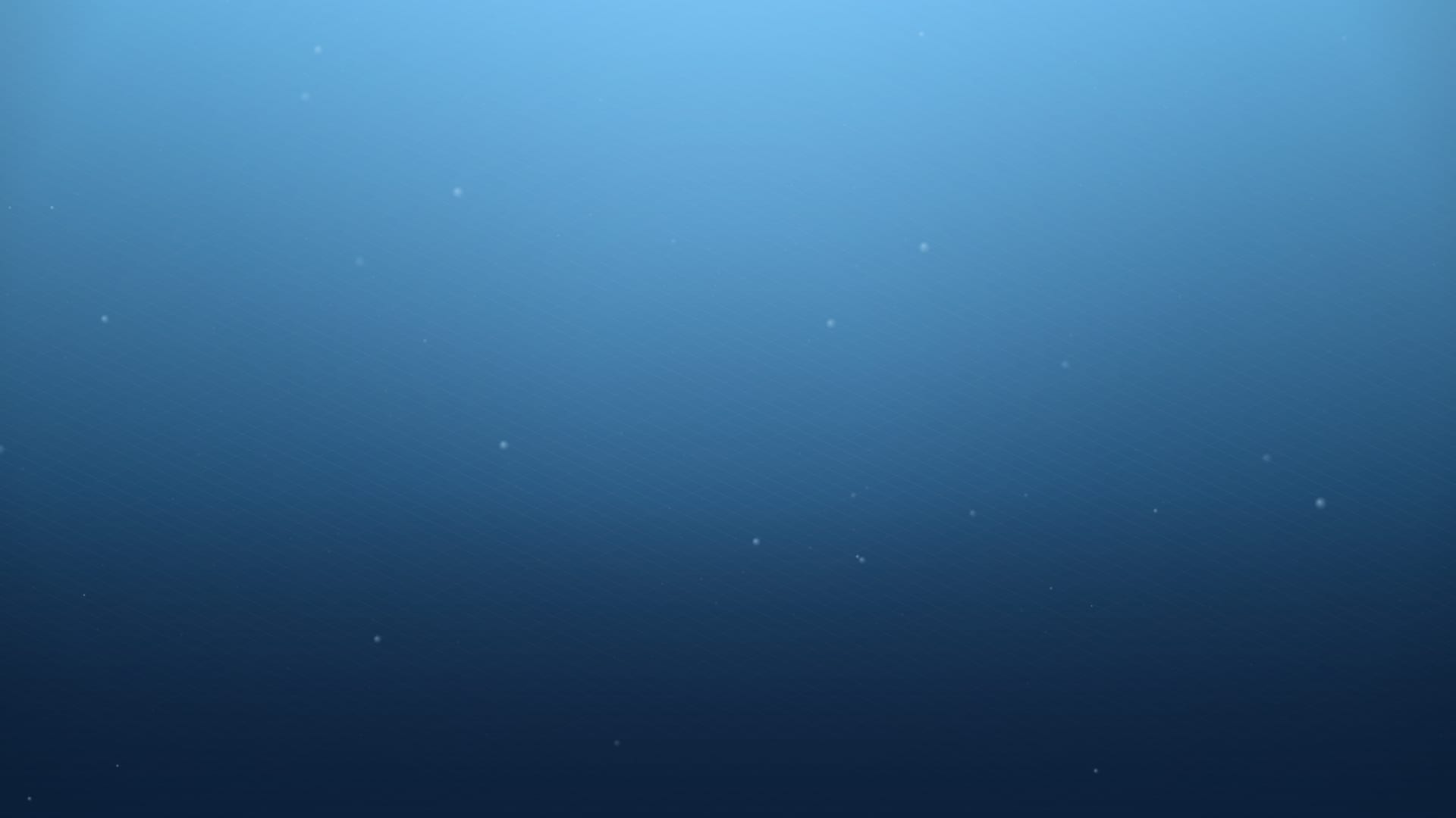 Freediver descending in clear blue ocean water